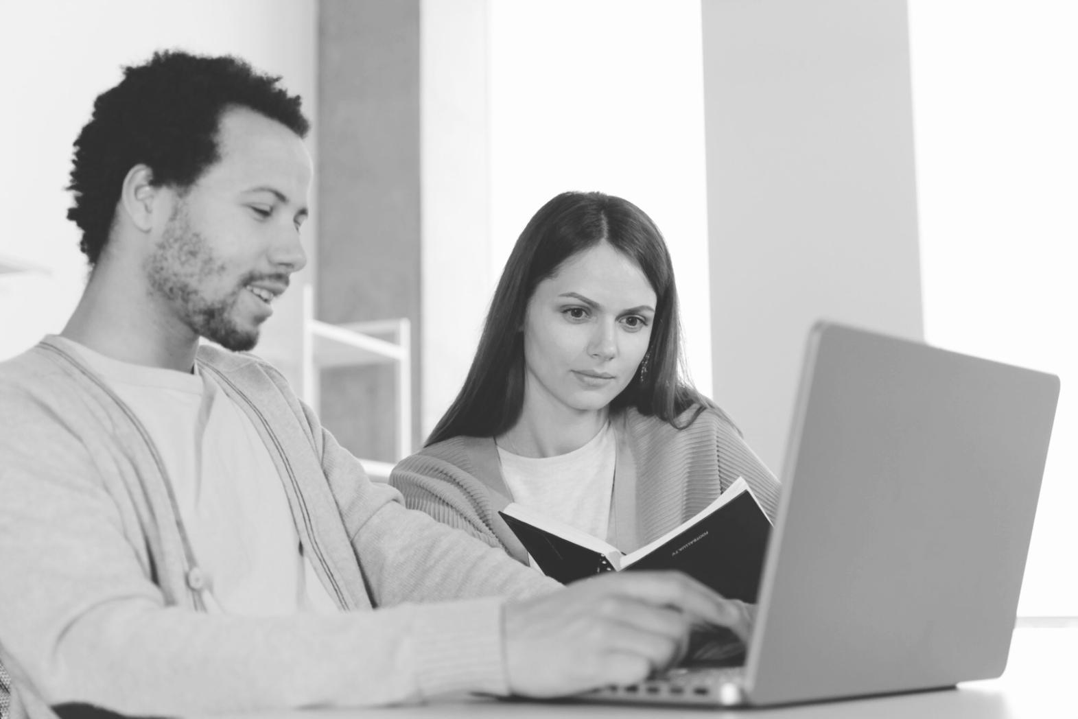 Office workspace with testing frameworks running on screens